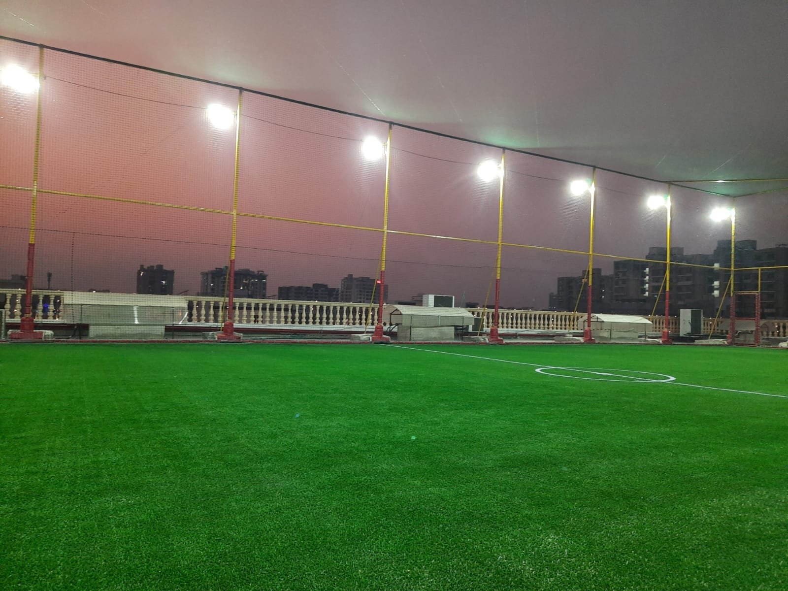 Sky Arena UP32CLUB enclosed rooftop turf with floodlights in Lucknow